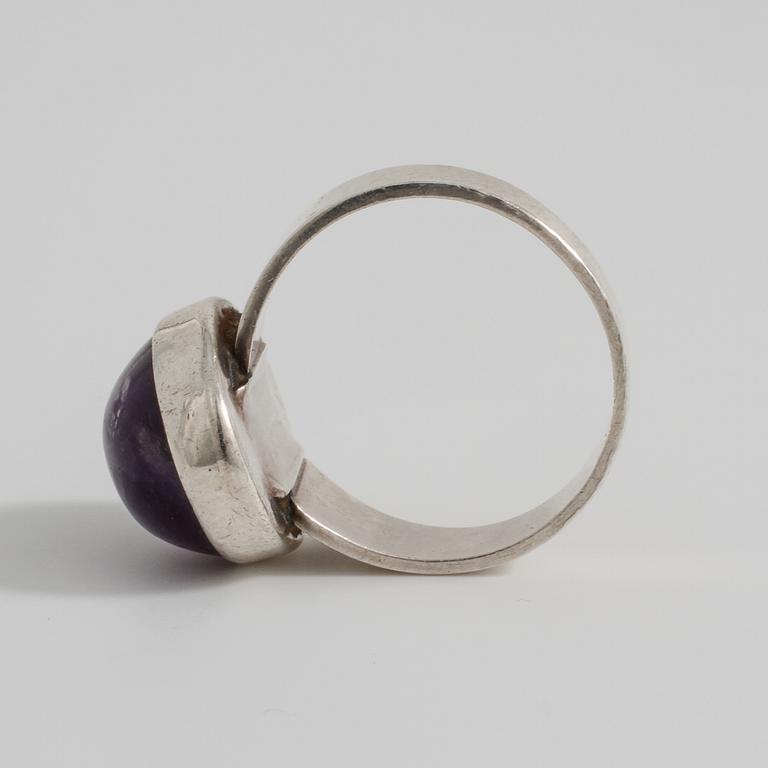 NIELS ERIK FROM, Nakskov, Denmark, a cabochon cut amethyst ring.