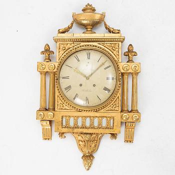 A Gustavian giltwood cartel clock by N. Berg (watchmaker in Stockholm 1751-94).