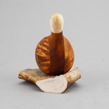 Lars Levi Sunna, a Sami reindeer horn and birch figurine of a grouse, signed LL Sunna.