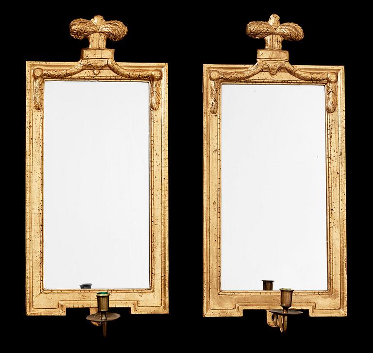 A pair of Gustavian late 18th century one-light girandole mirrors.