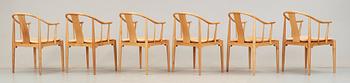 A set of six Hans J Wegner cherrywood and beige leather 'China chairs', Fritz Hansen, Denmark 1988 and 1994.