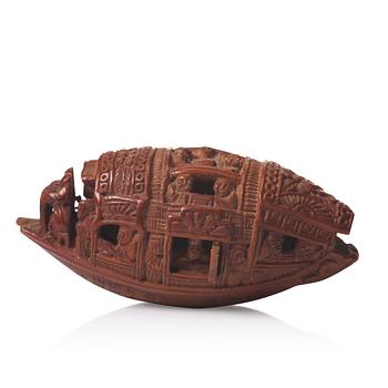 666. A Chinese nut boat sculpture, with poem.