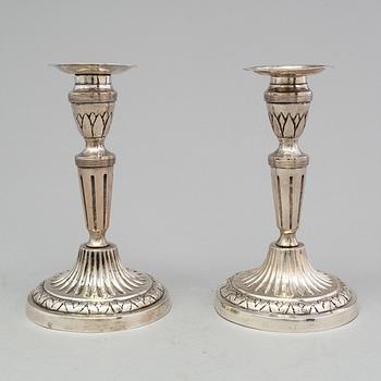 A pair of late 18th century silver candlesticks with unclear hallmarks, possibly from Germany. Weight ca 316 grams.