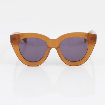 Karen Walker, a pair of orange glitter "Anytime" sunglasses.