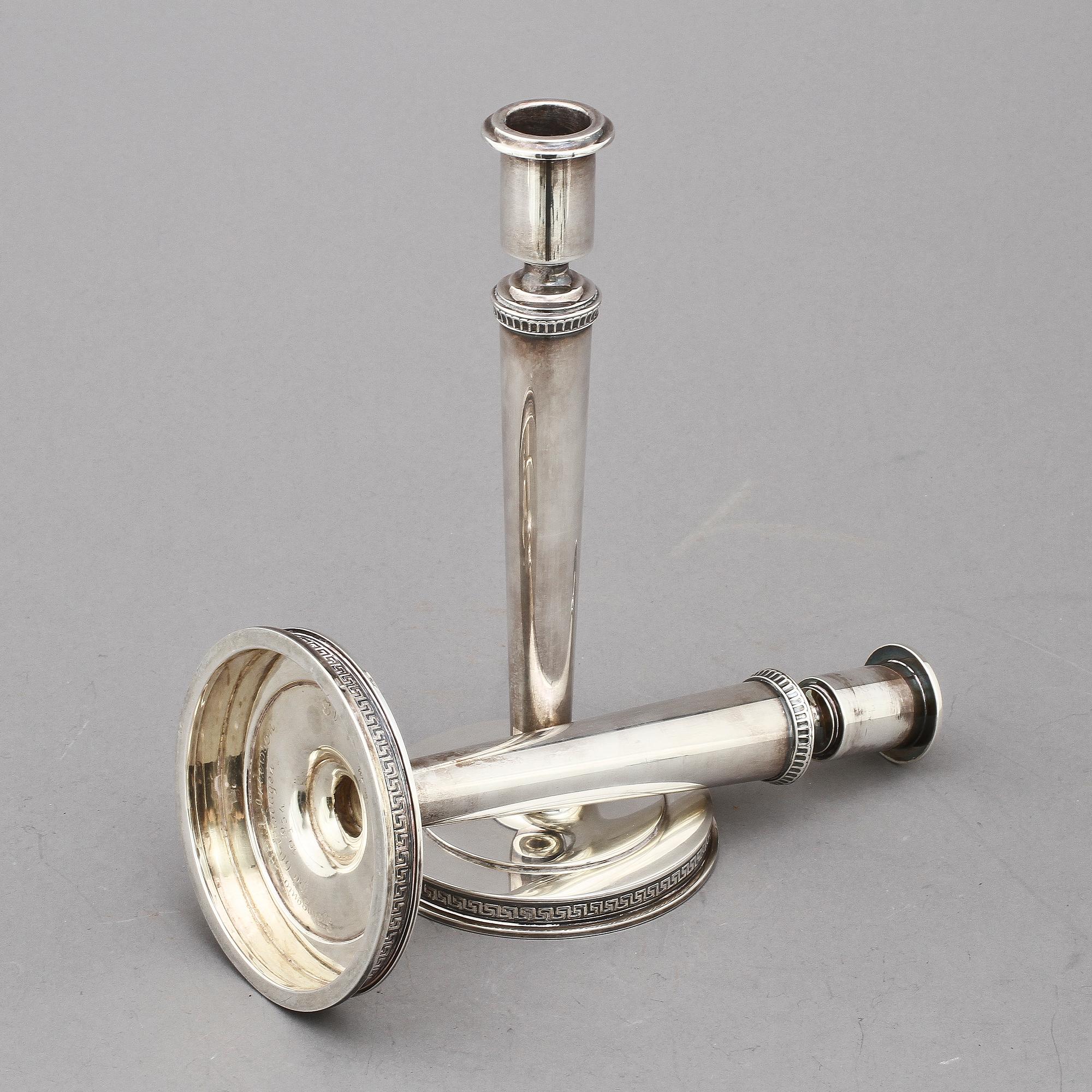 LJUSSTAKAR, ett par, silver, W A Bolin, Stockholm, 1949 och 1951. Tot. v. 616 g.