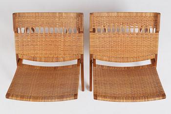 Hans J. Wegner, a pair of oak and rattan folding chairs 'JH-512', Johannes Hansen, Denmark 1950-60s.