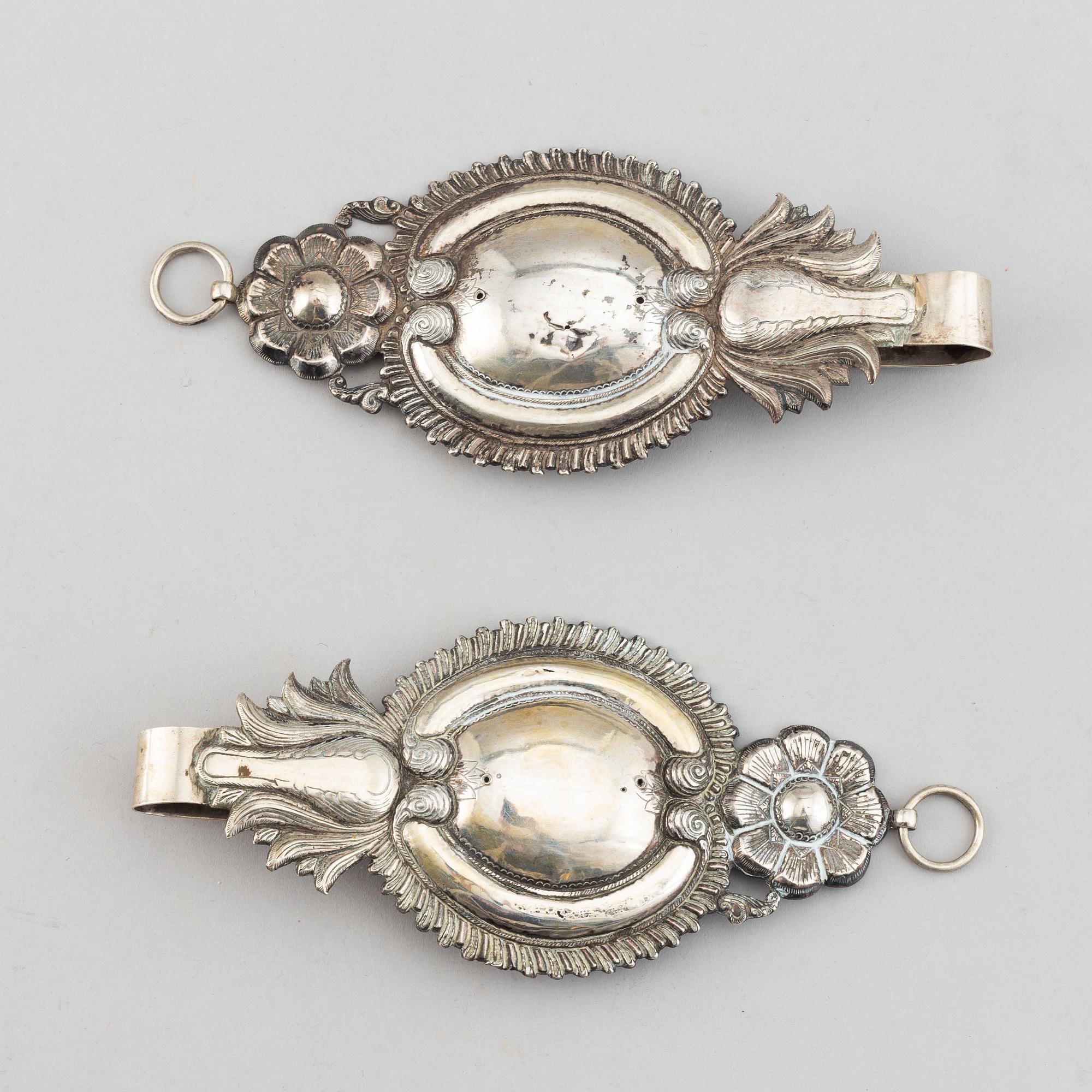 A pair of 19th century silver curtain tie-backs.