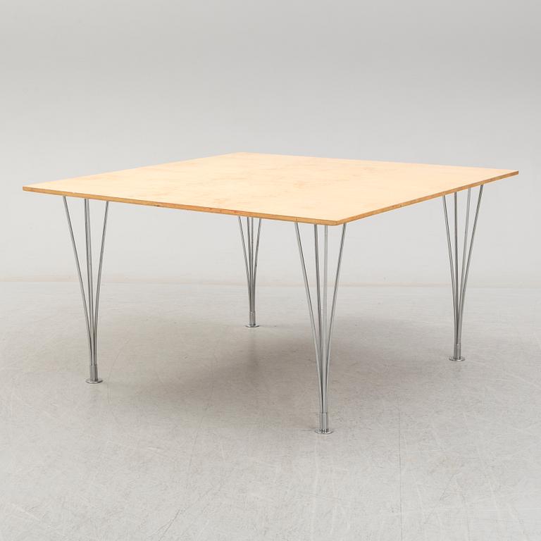 A birch veneered dining table by Bruno Mathsson and Piet Hein.