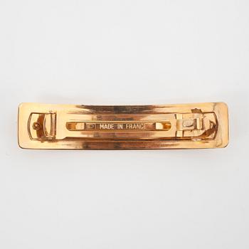 CHANEL, a gold colored metall hair clip.
