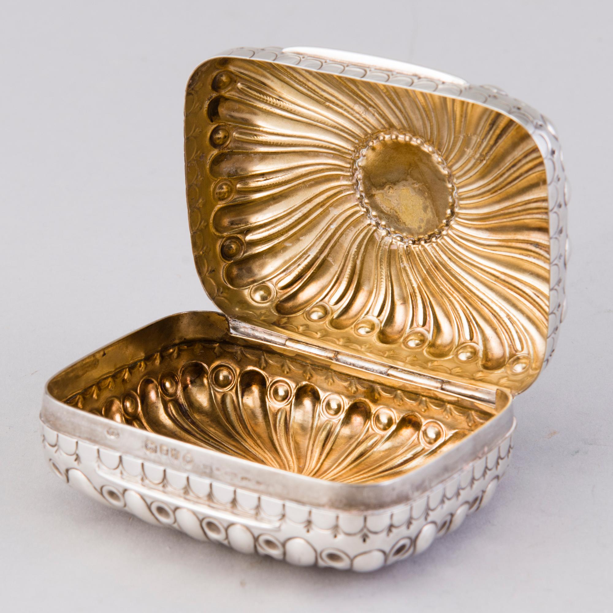 A hinged parcel-gilt soap case, London 1884.