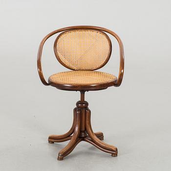 A BENTWOOD DESK CHAIR.