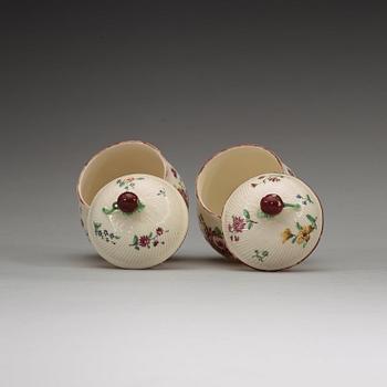 A pair of Swedish soft paste custard cups with covers, Marieberg, 18th Century.