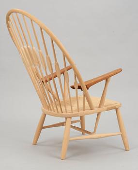 A Hans J Wegner ash and teak 'Peacock chair', by PP Møbler, Denmark.