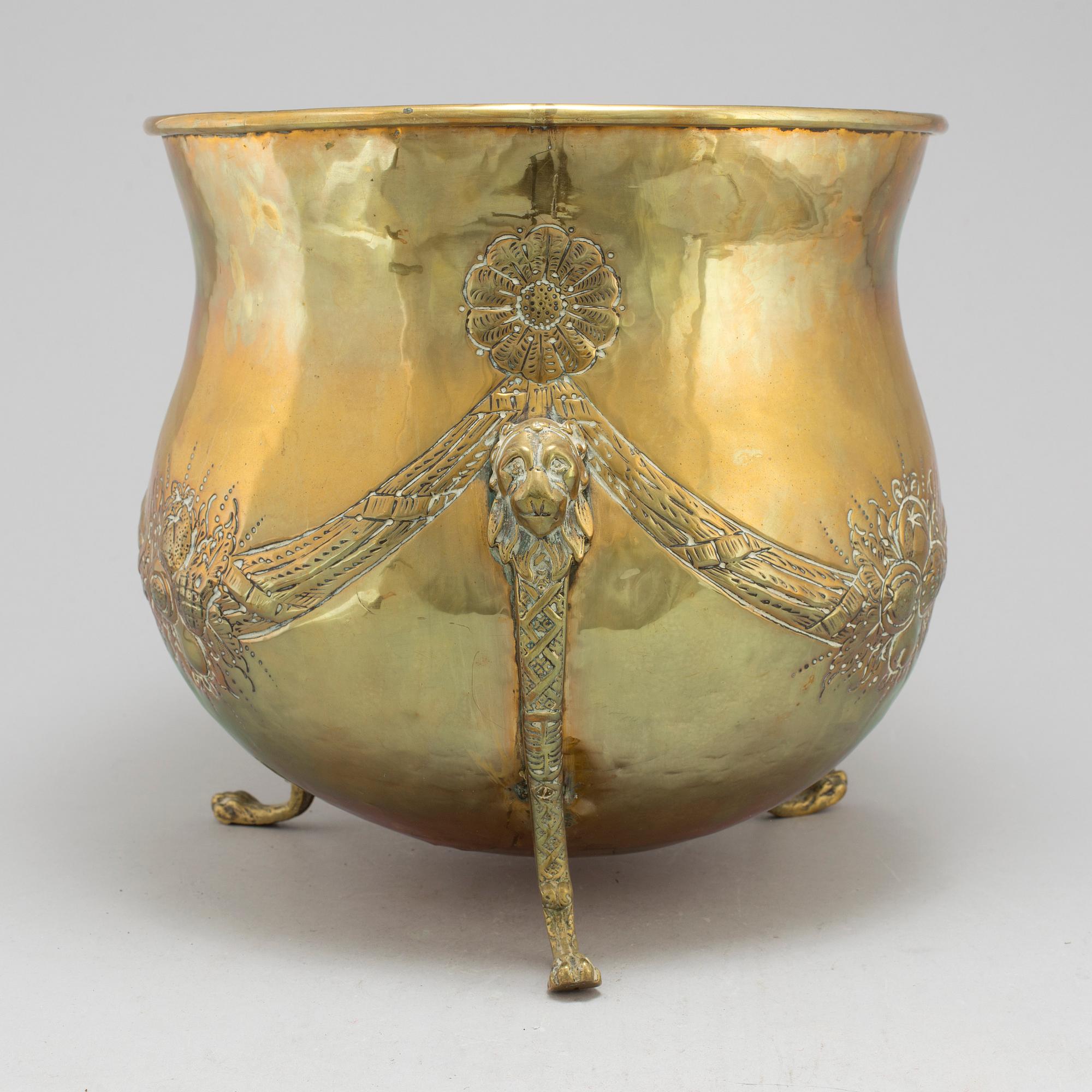 An 18th century brass flower pot.