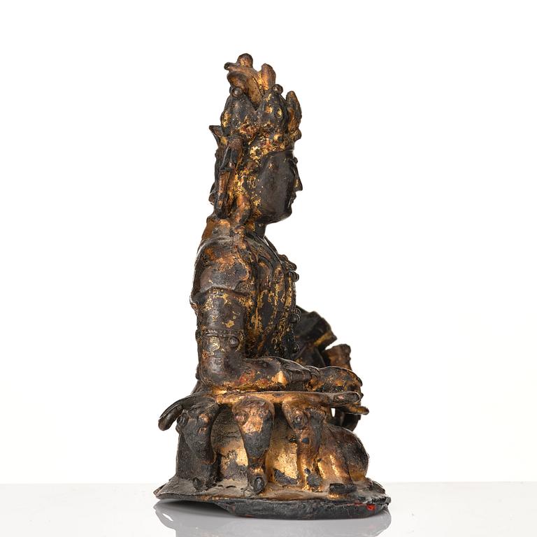 A cold gilt bronze figure of Avalokitshvara, Ming dynasty.