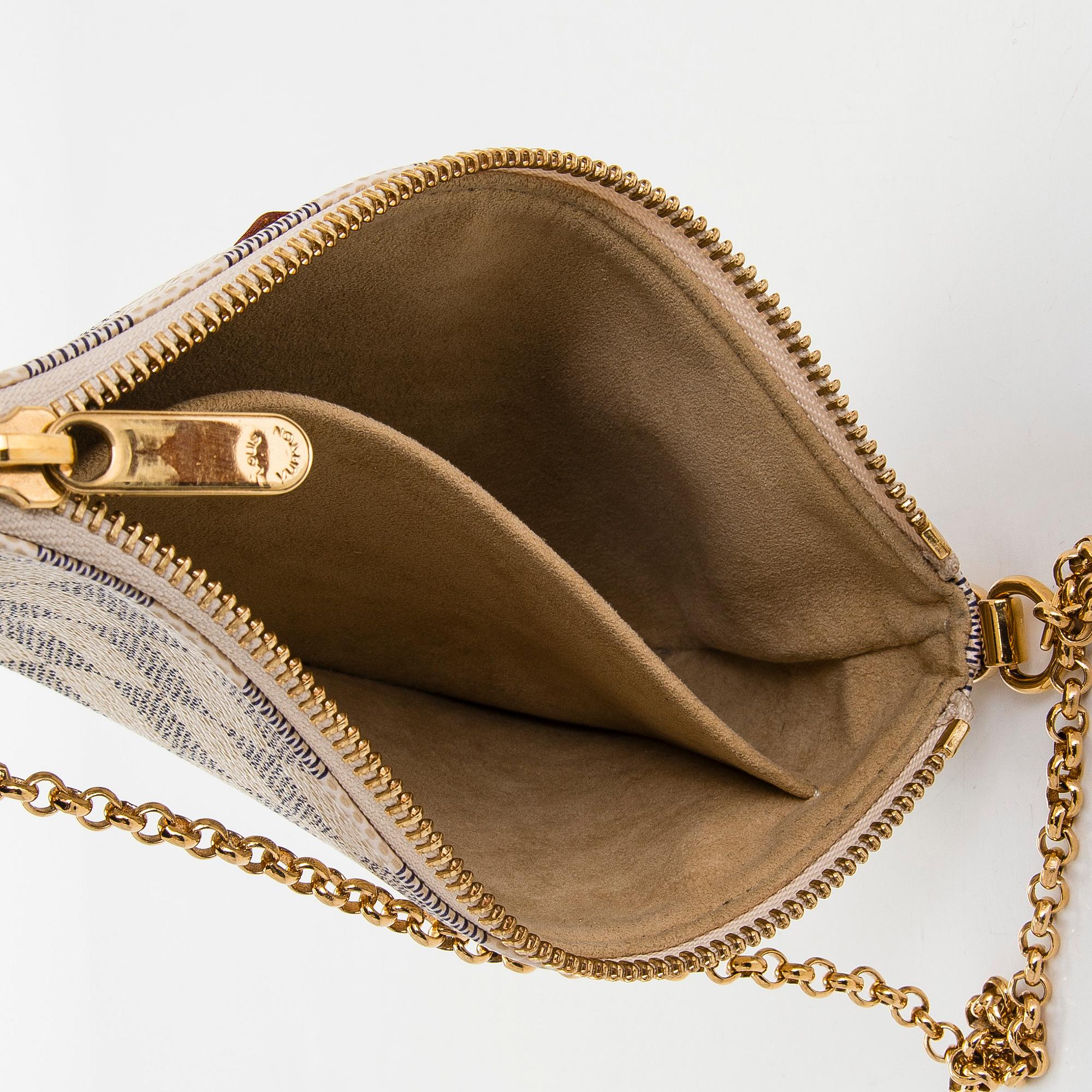 Louis Vuitton, a Damier Azur 'Milla MM Pochette' bag.