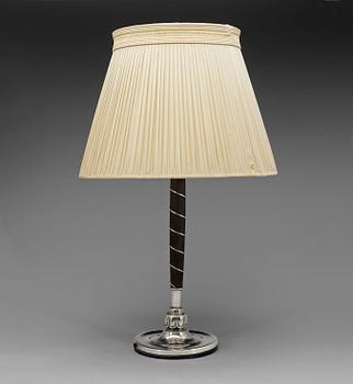 587. A C.G. Hallberg ebonized wood and silver table lamp, Stockholm 1928.
