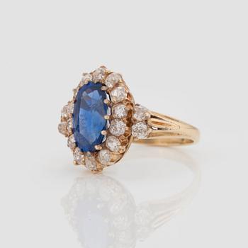 A RING set with a mixed-cut sapphire.