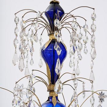 A Russian / Northern European Louis XVI-style gilt brass and blue glass six-branch chandelier, 19th century.