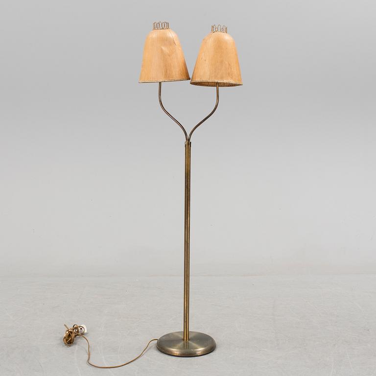 A brass floor lamp, mid 20 th century.