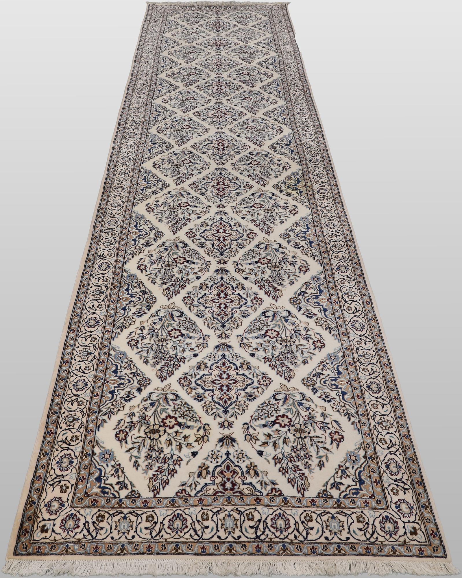 A Nain part silk carpet, 408 x 98 cm.
