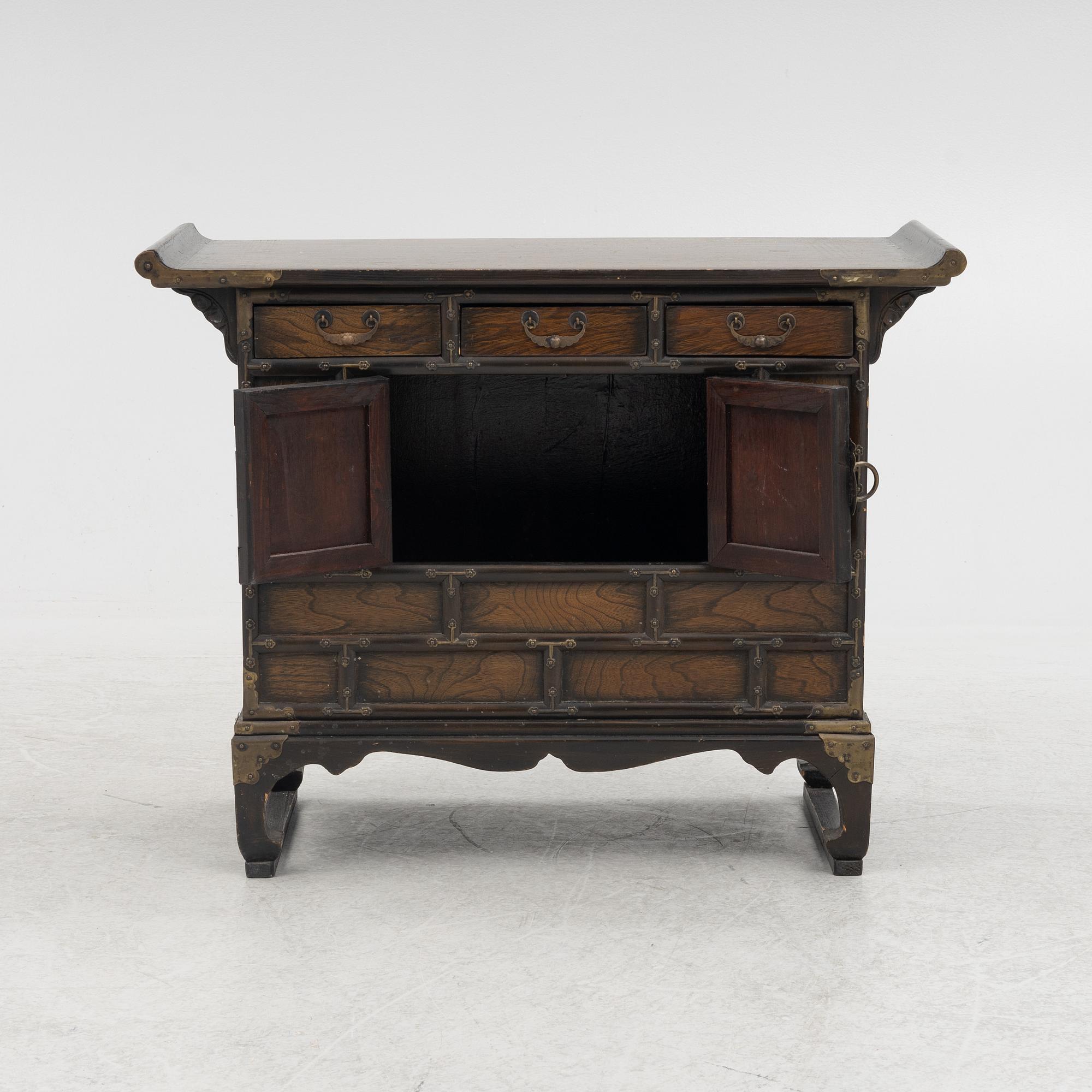 A Chinese hardwood cabinet, early 20th century.