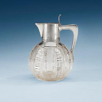 A Russian early 20th century glass and parcel-gilt jug, makers mark of the firm Morozov, (S:t Petersburg).