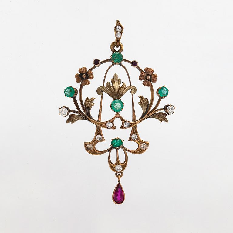 A 14K gold pendant with emeralds, rubies and diamonds ca. 0.45 ct in total. Russia early 20th century.
