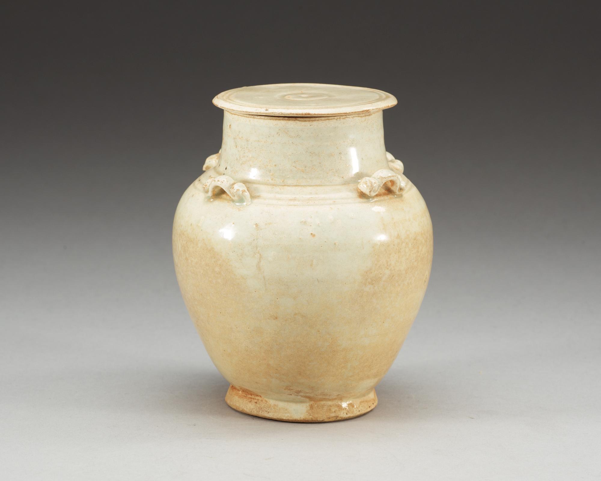 A pale green glazed jar with cover, Song dynasty (960-1279).
