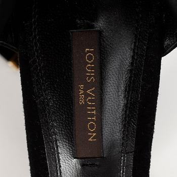 LOUIS VUITTON, a pair of black suede sandals.