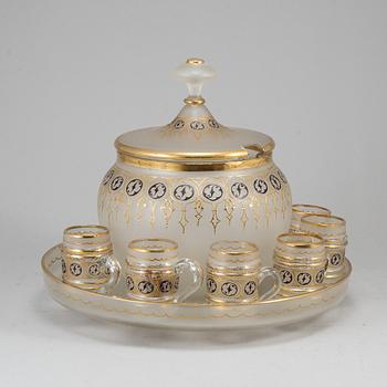 A glass punch bowl with eight jugs and turning dish, mid 19th century.