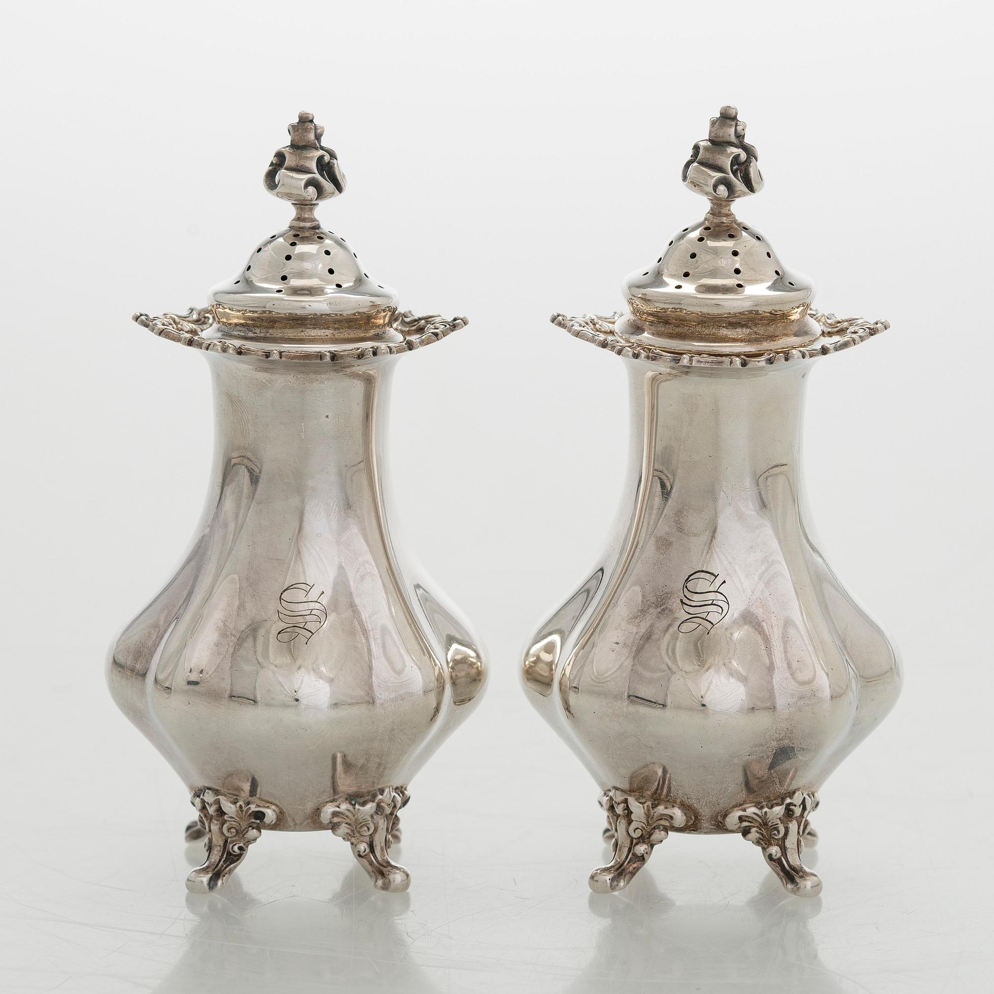 Black Starr & Frost, a pair of sterling silver shakers and sugar bowls, USA around 1900, Gorham pair of sterling spoons.