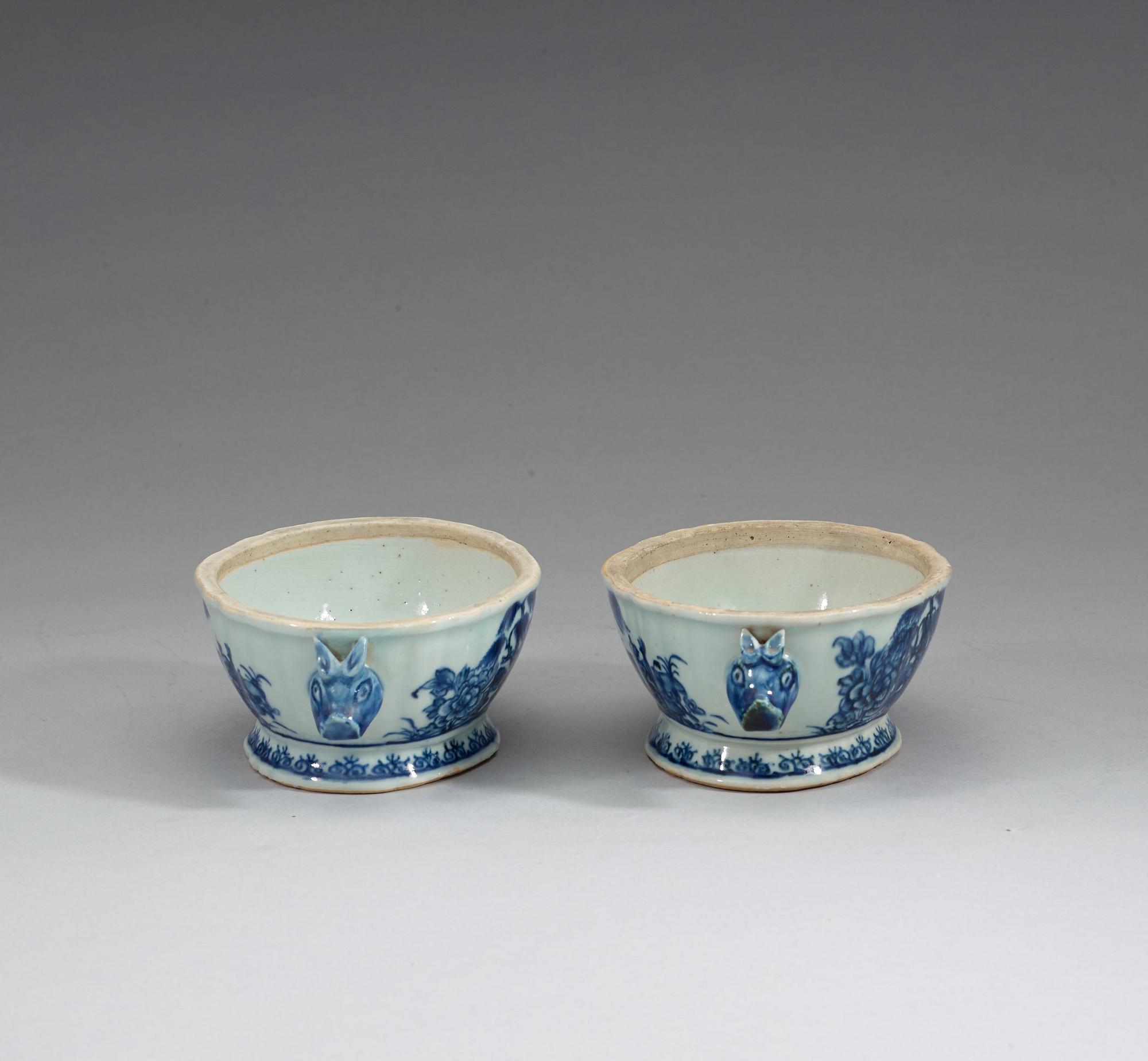 A pair of blue and white butter tureens with covers and stands, Qing dynasty, Qianlong (1736-95).
