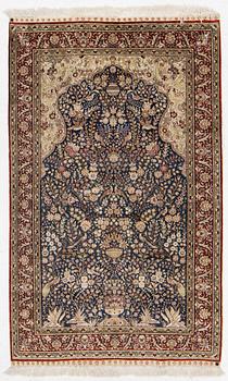 An oriental silk rug, c. 155 x 95 cm.