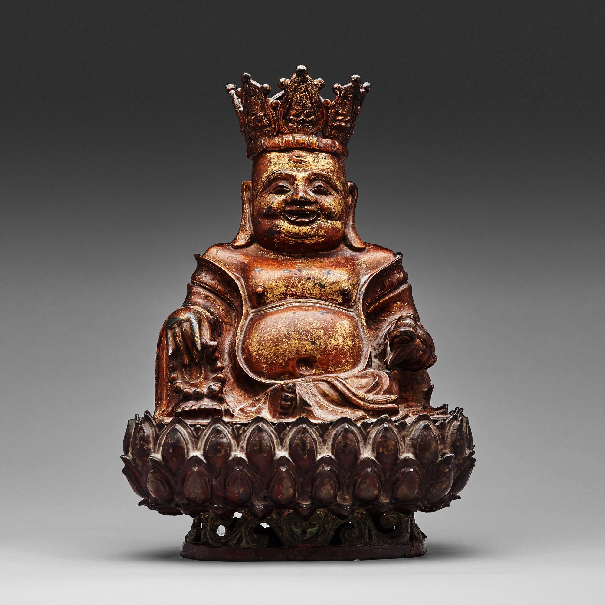 A large seated bronze figure of budhai, Ming dynasty (1368-1644).
