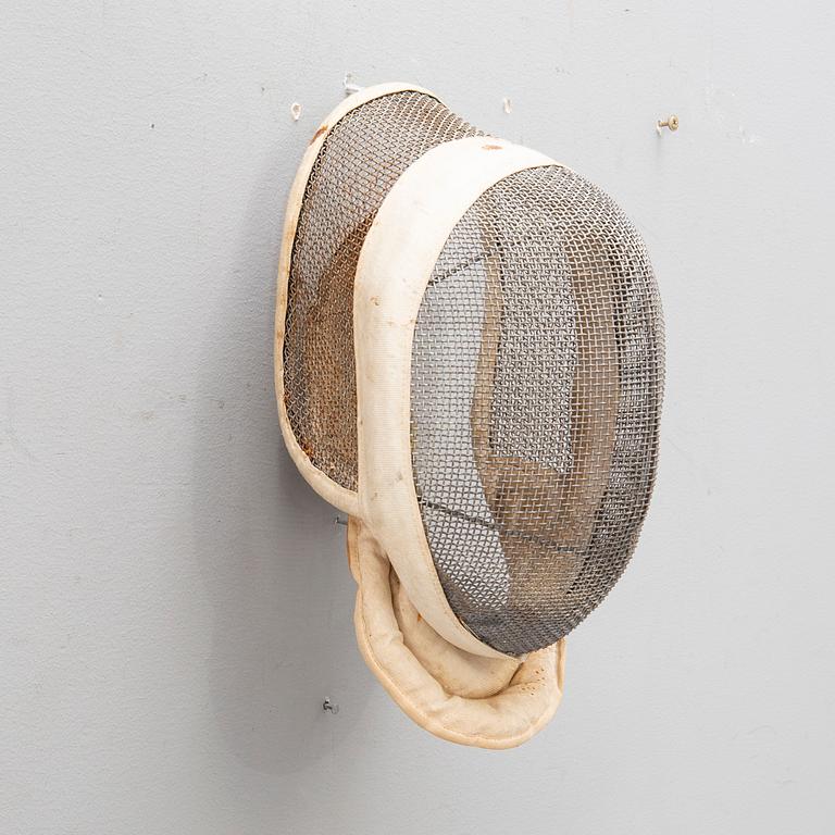 A French set of sword, mask and clothing for fencing, mid/second part of the 20th century.