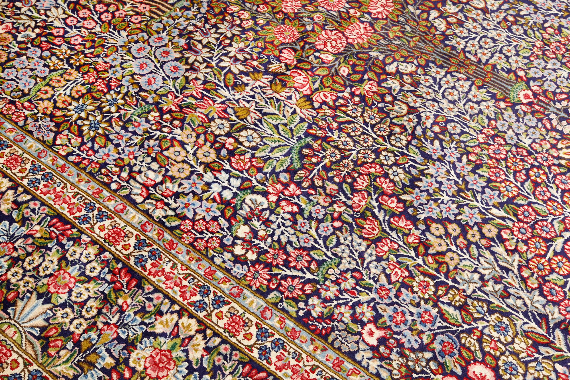 A Kirman Laver carpet, 'Millefleur', approx. 400 x 295 cm.