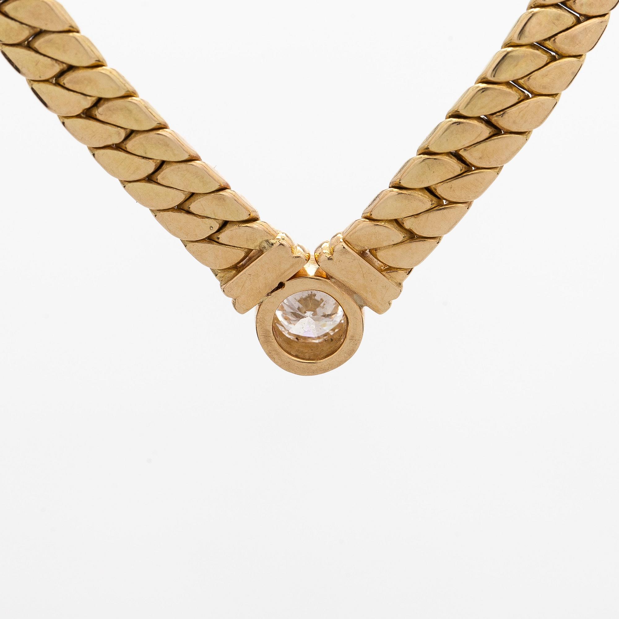 Collier, 18K guld och en briljantslipad diamant.