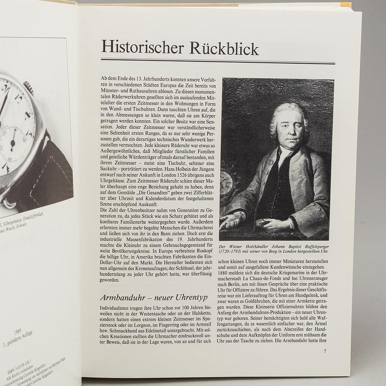 A set of 5 watch books.