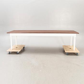 A painted and stained table 21st century.