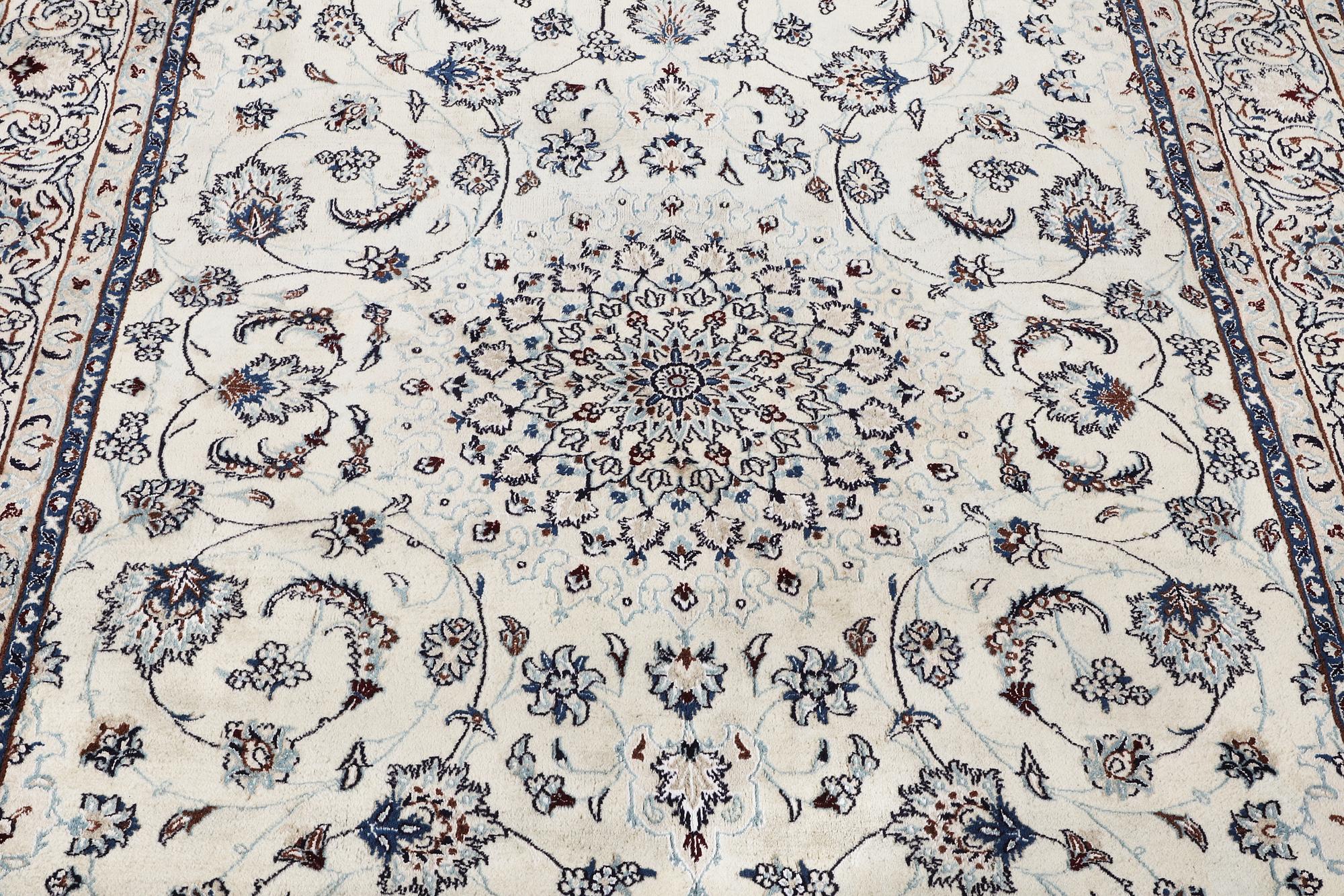 A Nain carpet, part silk, c. 294 x 193 cm.
