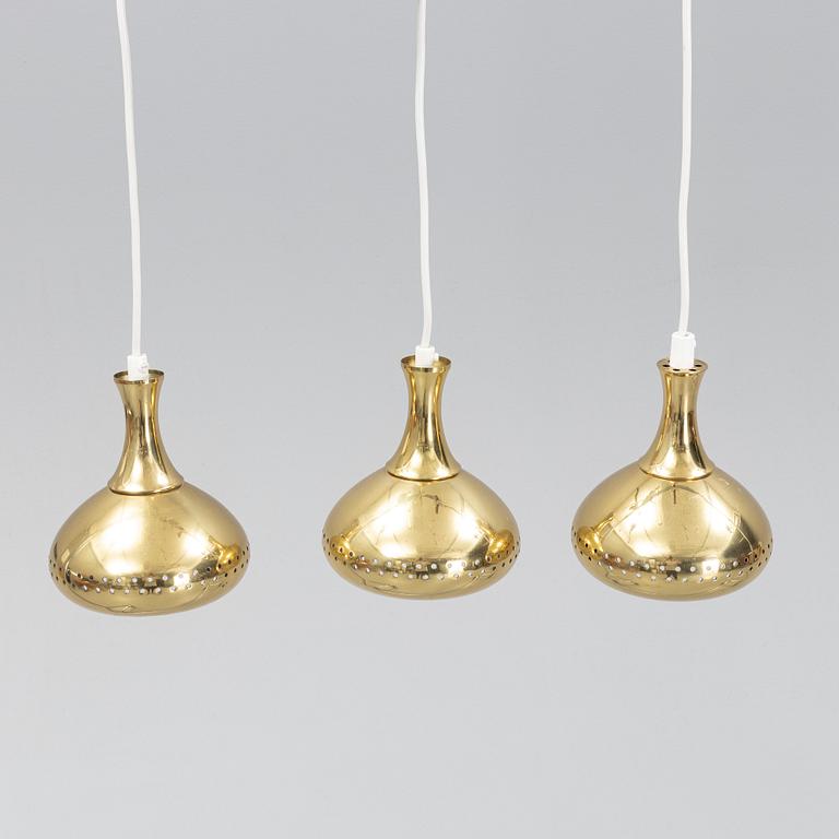 A set of three brass pendule lights, second half of the 20th Century.