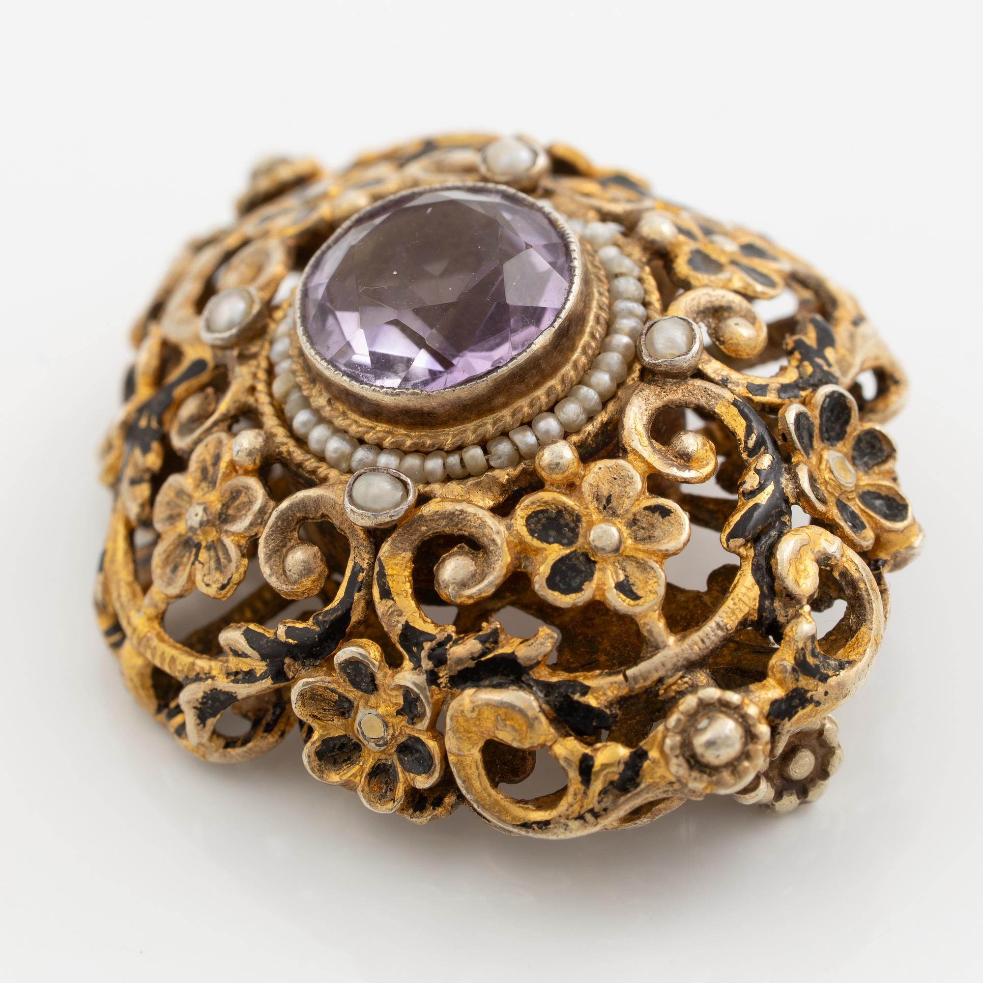 Brooch, gilded silver with amethyst and seed pearls.