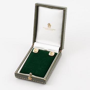 A pair of platinum and gold earrings with two radiant-cut yellow diamonds.