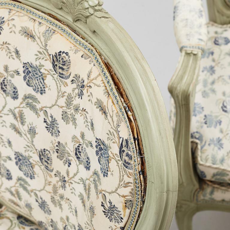 A pair of rococo-style open armchairs, 20th century.