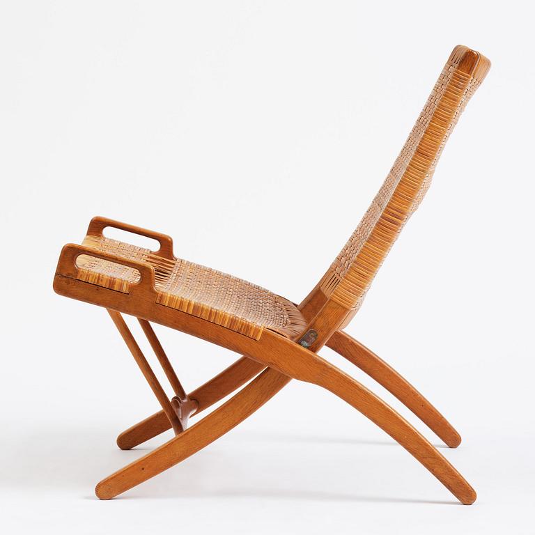 Hans J. Wegner, a foldable easy chair model 512, Johannes Hansen, Copenhagen, 1950s-60s.