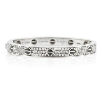 An 18K white gold Cartier bracelet "Love" with round brilliant-cut diamonds and ceramic.