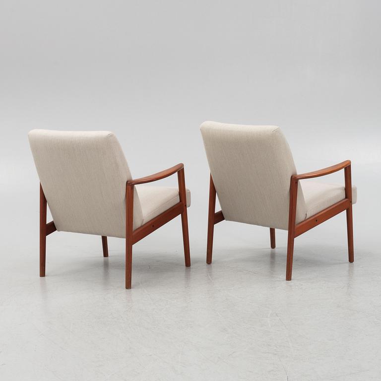 A pair of mid-century easy chairs.