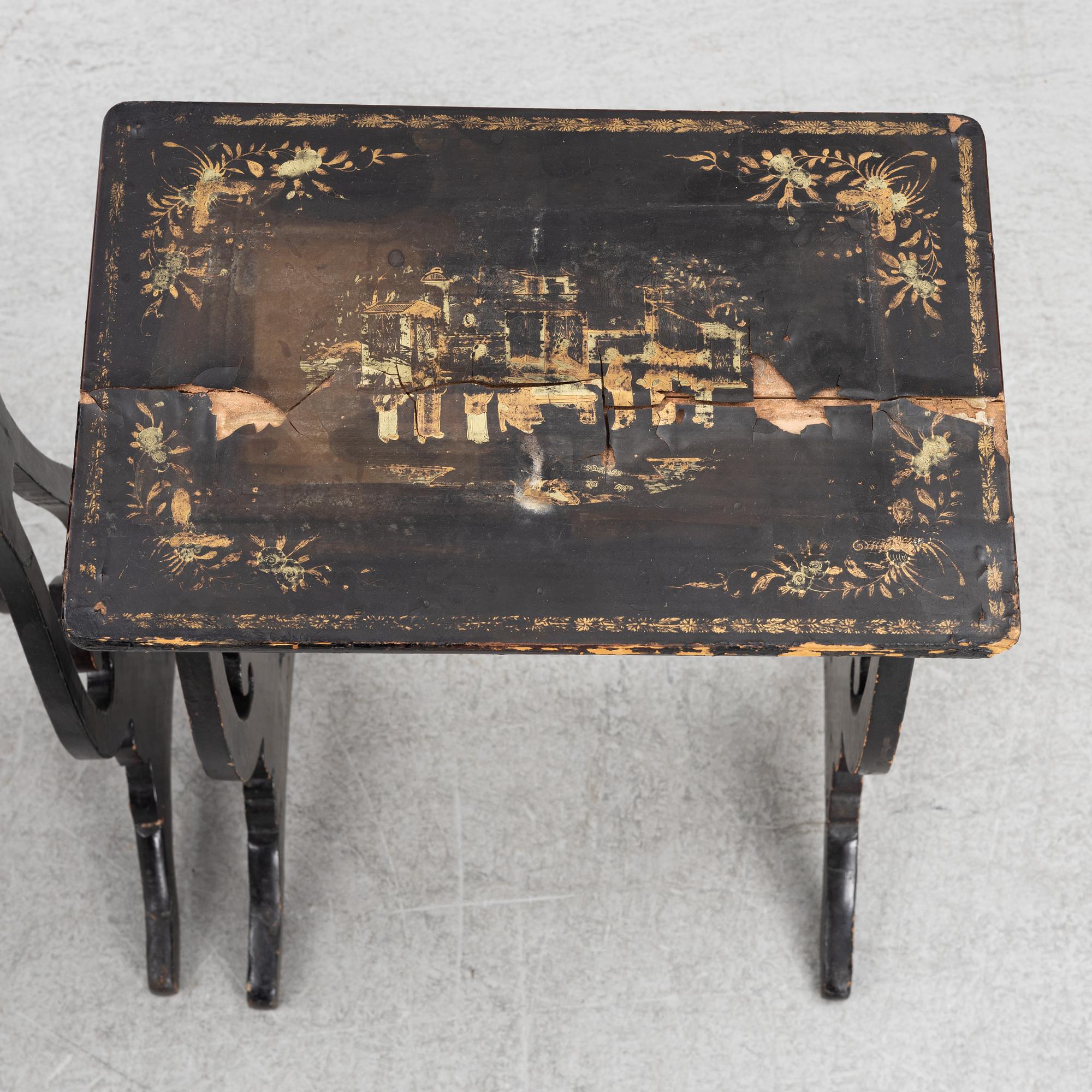 A lacquered nesting table, around 1900.