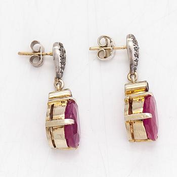 A pair of gilded sterling silver earrings with rubies, rose and brilliant cut diamonds.